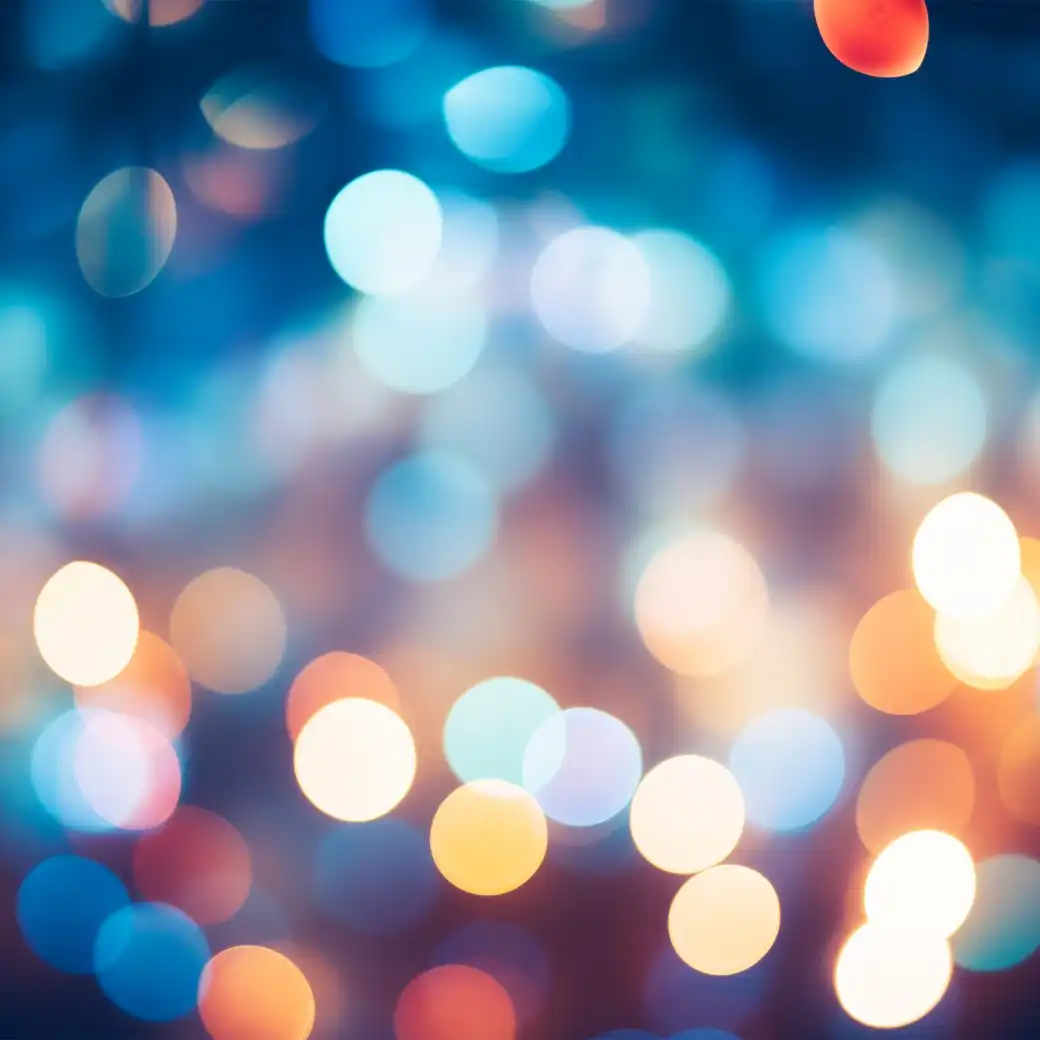 Out-of-focus city lights in blue, white and amber circles