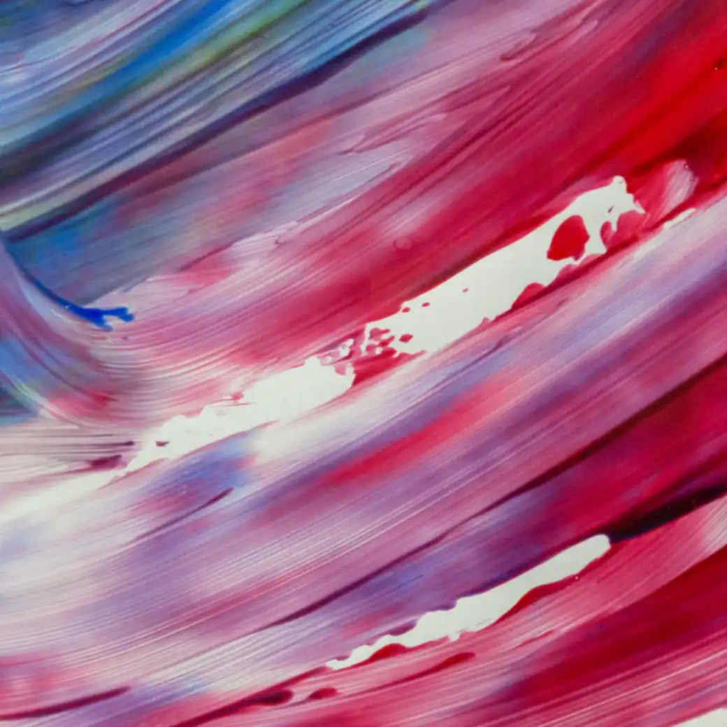 Thick strokes of red, white and blue paint dragged across a canvas